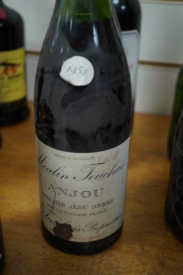 Six bottles of wine including three bottles of Moulin Touchais Anjou 1959, Prince Consort Costieres di Gard, two bottles of St. Emilion 1979, etc.
